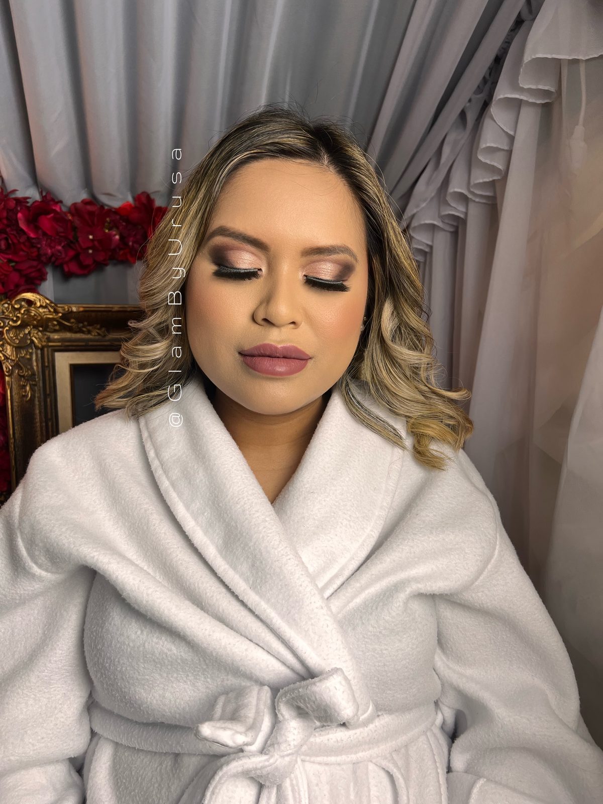Bridal party makeup with neutral shimmer eyes and soft Hollywood waves during a getting-ready session