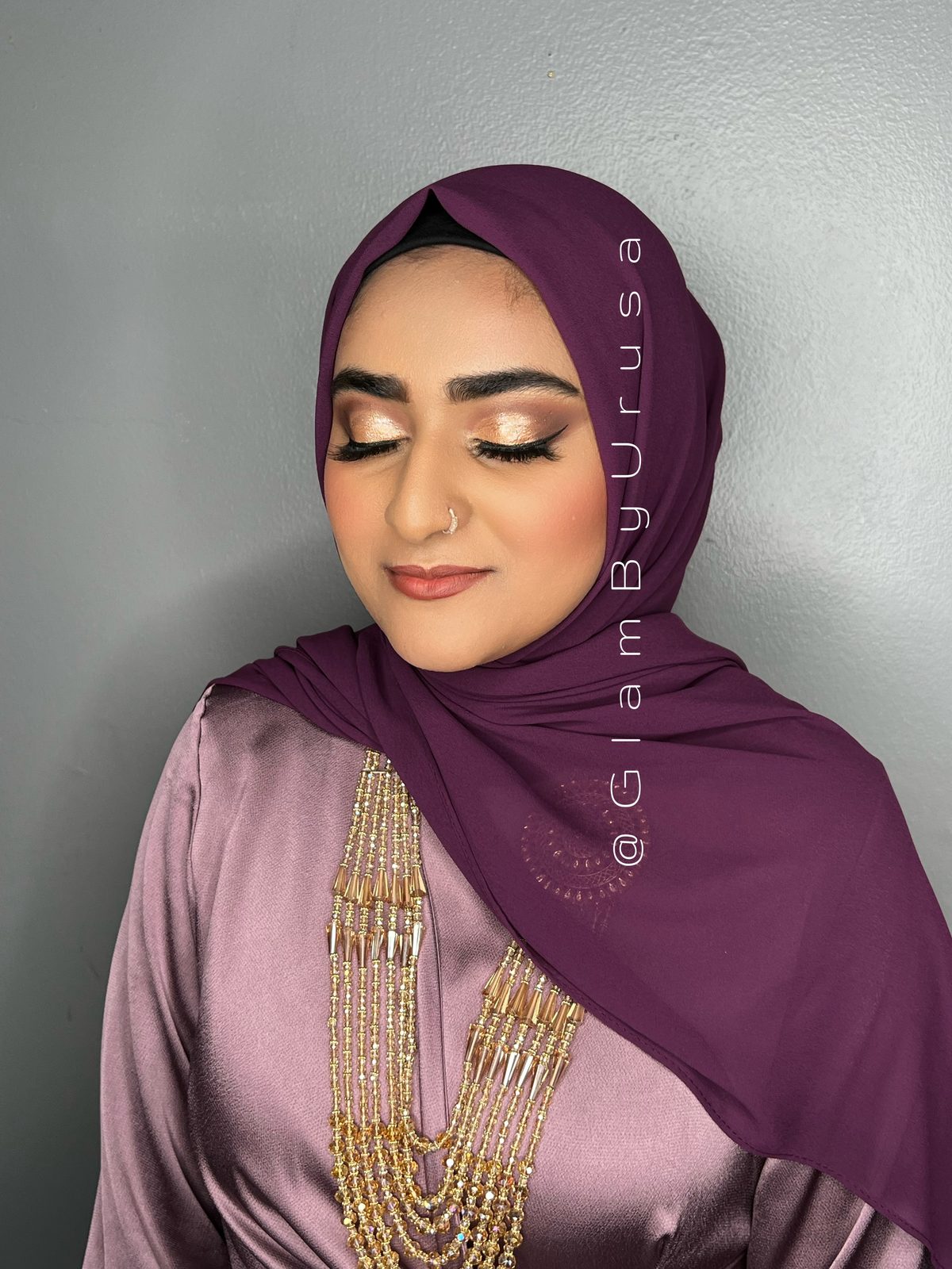 Hijab-friendly semi-bridal makeup with warm gold eyeshadow, fluttery lashes and a soft glam finish
