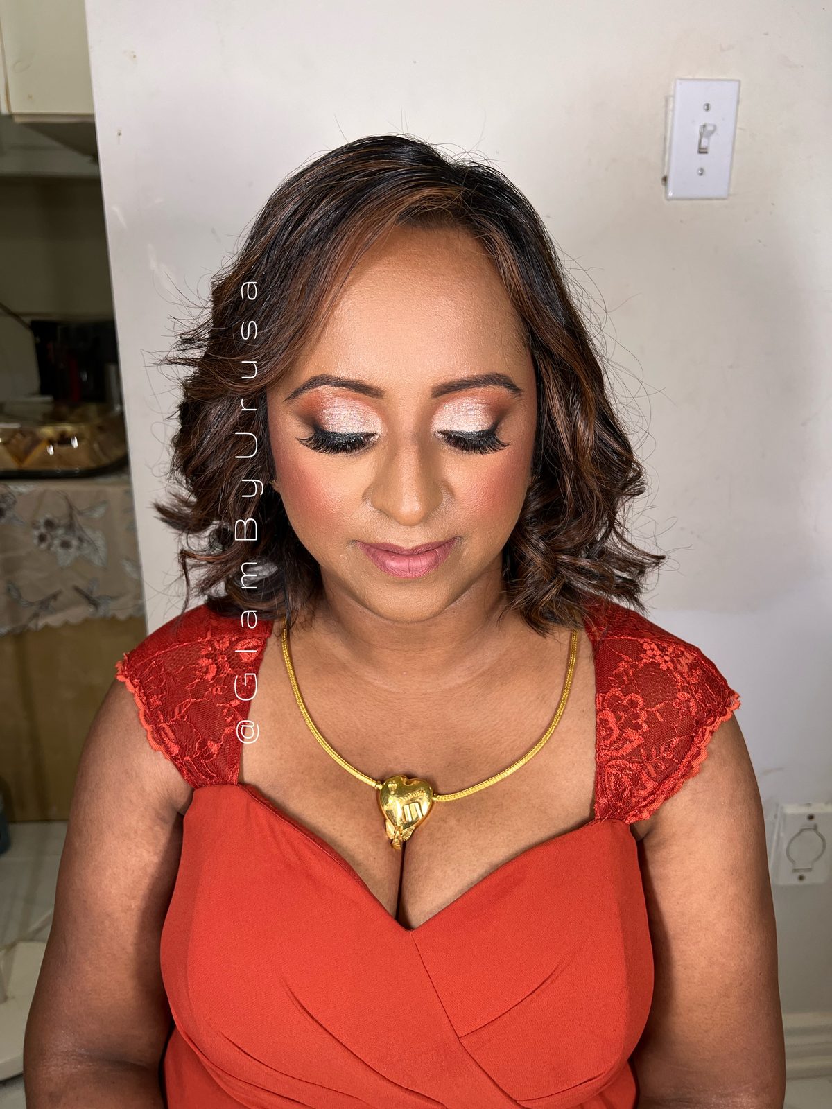 Radiant event makeup with silver-toned eyeshadow and a soft curled blowout