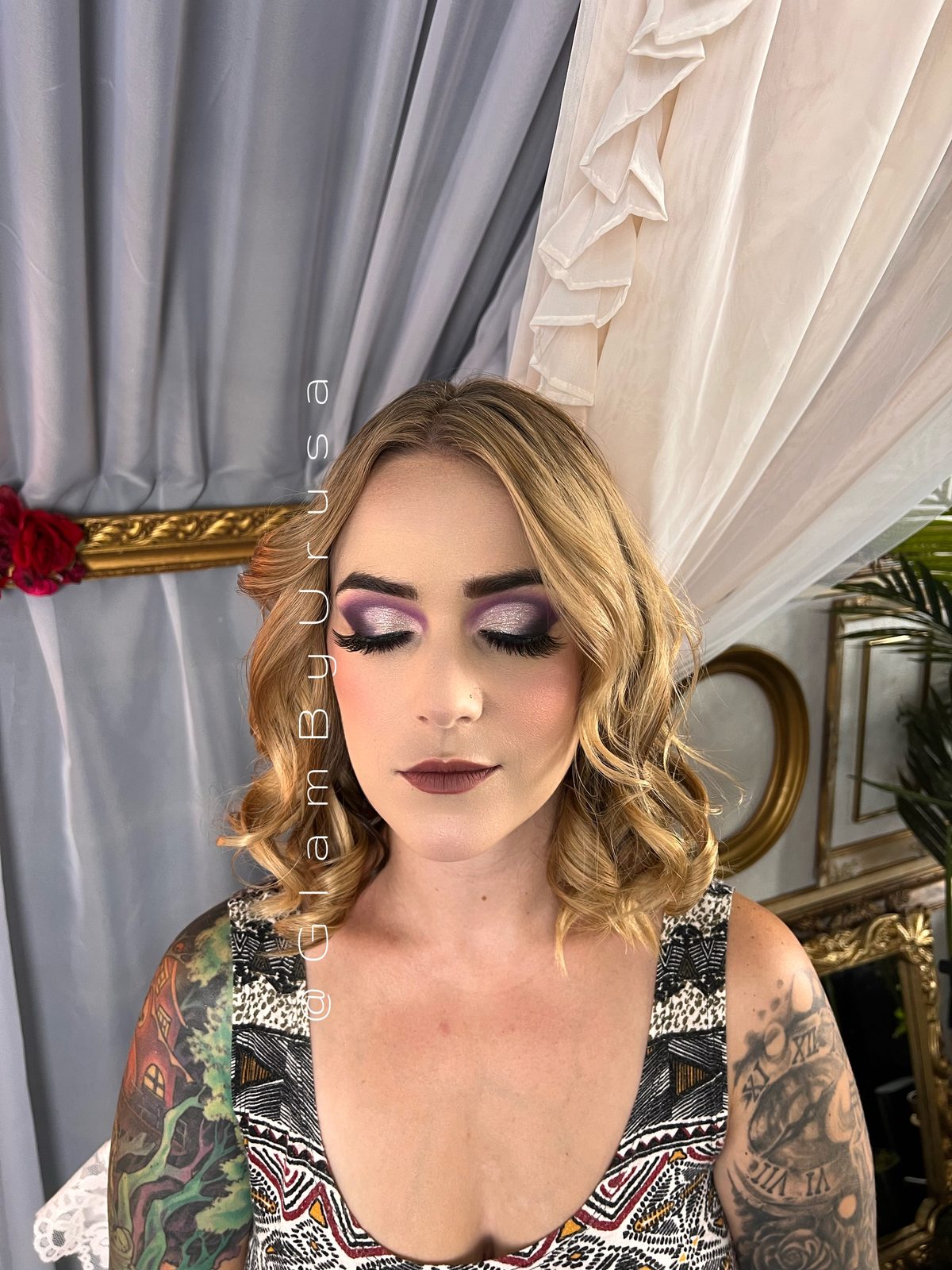 Event makeup with a lilac smokey eye, sculpted cheekbones and styled curls