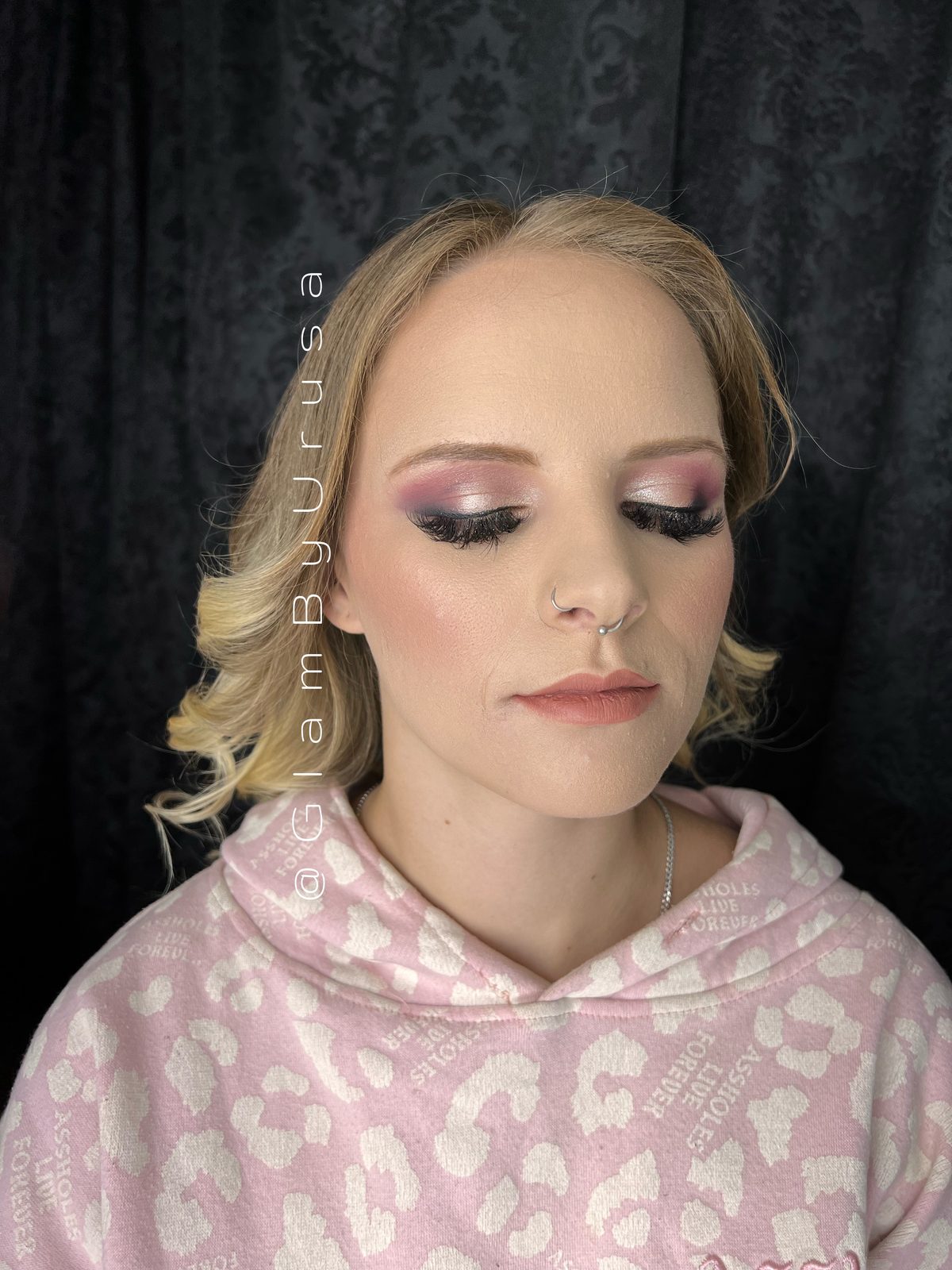 Pink halo eye makeup with fluttery lashes, glowing skin and a nude lip