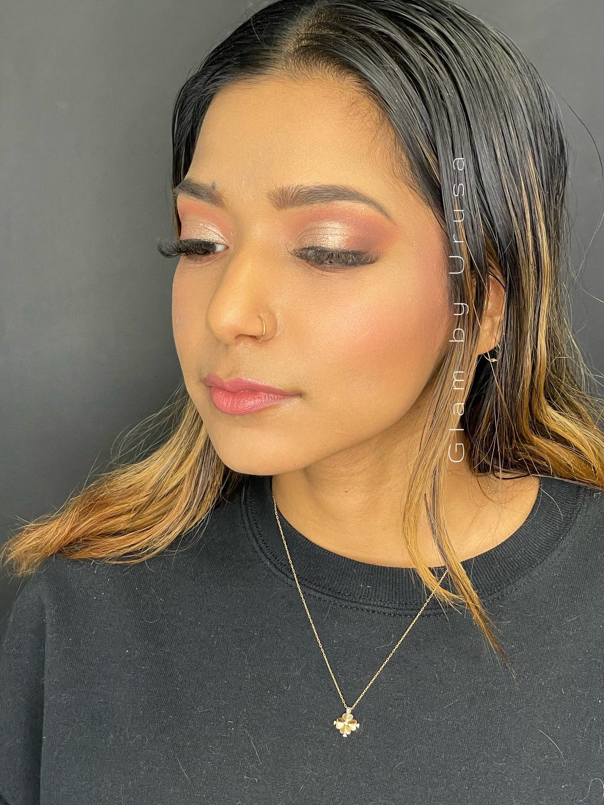 Non-bridal soft glam makeup with rose gold eyeshadow, a glowing skin finish and a glossy nude lip